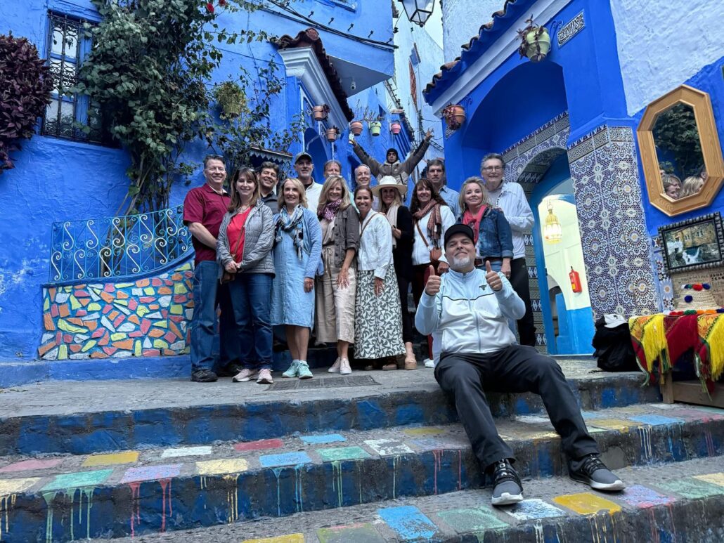 18 Days Morocco Tours From Casablanca,Hassan II Mosque in Casablanca during 18-day Morocco tour." "Blue streets of Chefchaouen on Morocco tour from Casablanca." "Camel trekking in Merzouga Sahara Desert, Morocco." "Ancient kasbahs of Ait Benhaddou on Morocco travel itinerary." "Ouzoud Waterfalls scenic view on Morocco tour." "Vibrant souks and gardens of Marrakech on Morocco tour."