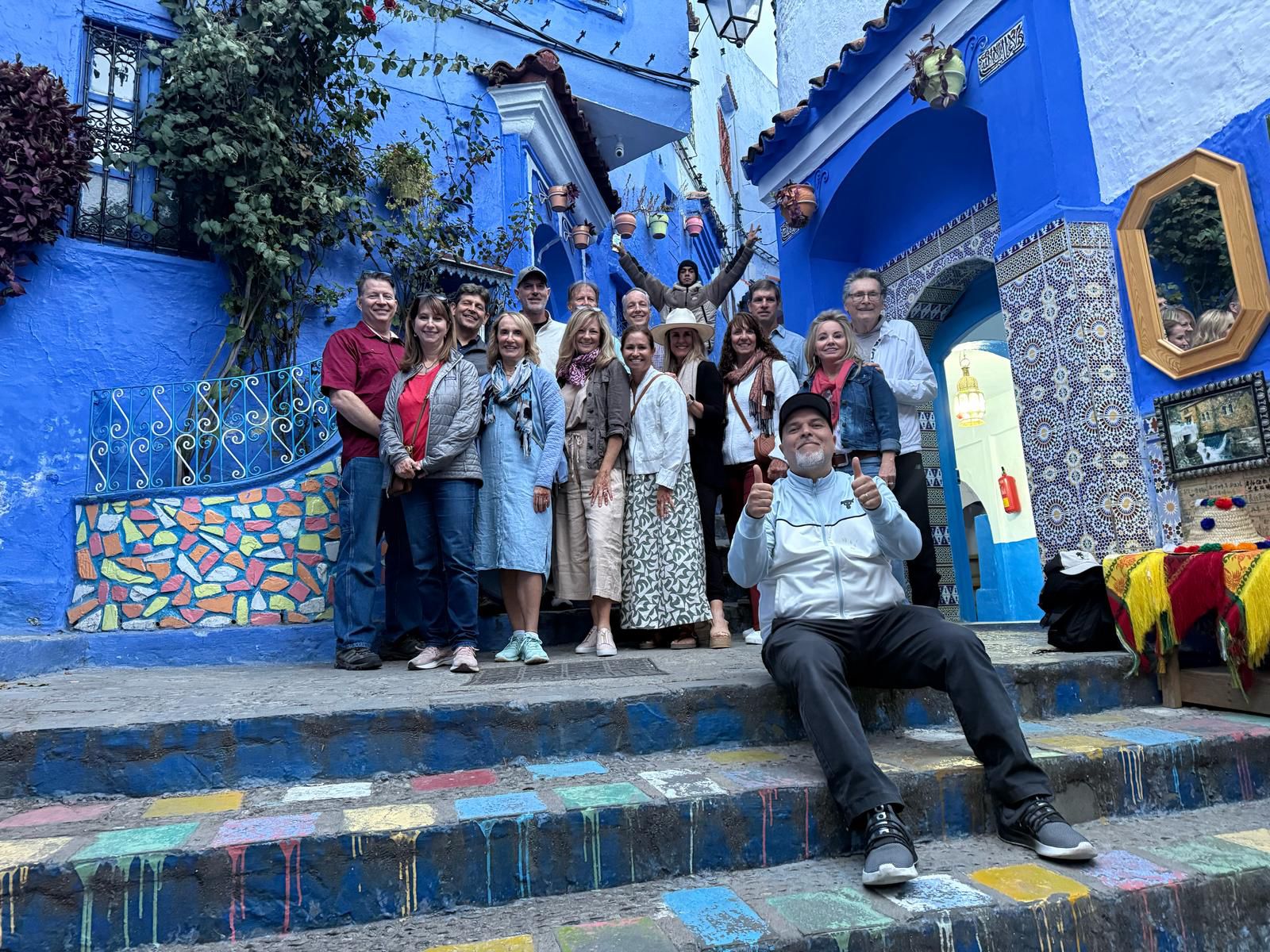 18 Days Morocco Tours From Casablanca,Hassan II Mosque in Casablanca during 18-day Morocco tour." "Blue streets of Chefchaouen on Morocco tour from Casablanca." "Camel trekking in Merzouga Sahara Desert, Morocco." "Ancient kasbahs of Ait Benhaddou on Morocco travel itinerary." "Ouzoud Waterfalls scenic view on Morocco tour." "Vibrant souks and gardens of Marrakech on Morocco tour."