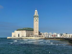 10 Days Morocco Tour,Casablanca – Hassan II Mosque: “Hassan II Mosque in Casablanca, Morocco, on a sunny day, showcasing its intricate architecture and oceanfront location.” Chefchaouen – Blue City: “Scenic streets of Chefchaouen, Morocco, painted in vibrant shades of blue with traditional Moroccan architecture.” Meknes & Volubilis: “Ancient Roman ruins of Volubilis near Meknes, Morocco, with historic columns and archaeological site views.” Ziz Valley: “Lush Ziz Valley in Morocco, with palm trees, desert landscapes, and winding river views.” Merzouga Desert: “Golden sand dunes of Merzouga in the Sahara Desert, Morocco, with camel caravans at sunset.” Sahara Desert Camp: “Traditional desert camp in Merzouga, Morocco, under a starry night sky in the Sahara Desert.” Todra Gorge: “Dramatic cliffs and narrow canyon of Todra Gorge in Morocco, ideal for hiking and adventure.” Dades Valley: “Rocky landscapes and winding roads of Dades Valley, Morocco, surrounded by towering cliffs.” Ait Benhaddou: “UNESCO World Heritage site Ait Benhaddou in Morocco, historic ksar with earthen clay architecture.” Marrakech – Jemaa el-Fnaa: “Vibrant Jemaa el-Fnaa square in Marrakech, Morocco, filled with market stalls, locals, and tourists.”