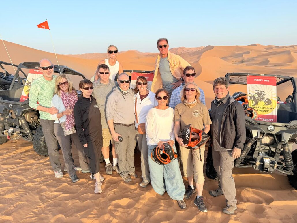 5 Days Morocco Desert Tour,A camel caravan casts long shadows as it walks along the crest of a golden sand dune under a vast desert sky. Collage of a Morocco desert tour: a winding mountain road, the ancient earthen walls of Ait Ben Haddou, and a Berber tent under a starry night sky.,A scenic, winding road cuts through the rugged, snow-dusted peaks of the High Atlas Mountains. Panoramic view of the High Atlas Mountains from the Tizi n'Tichka pass.,The sun illuminates the towering, earthen clay architecture of the UNESCO World Heritage site, Ait Ben Haddou. A detailed view of the ancient, fortified village (ksar) of Ait Ben Haddou, built into a hillside.,The winding road of the Dades Gorges, known as the "Road of a Thousand Kasbahs," snakes through a dramatic red rock canyon. View of the striking, winding river canyon and unique rock formations of the Dades Gorges.,A person stands at the base of the towering, vertical cliff faces of the Todra Gorges, highlighting its immense scale. The narrow, deep canyon of Todra Gorges with a clear stream running through it.,An aerial view of the lush, green palm groves of the Ziz Valley oasis contrasting sharply with the surrounding arid desert. A vast sea of palm trees in the Ziz Valley, an oasis in the Moroccan desert.,Camel Trek: A line of camels carrying tourists walks across the orange-red sand dunes of Erg Chebbi at sunset. Smiling person riding a camel on a trek into the Sahara desert. Desert Camp: Traditional Berber tents set amongst the golden sand dunes of the Sahara under a clear blue sky. A cozy desert camp at night, with lanterns illuminating tents against a backdrop of stars. Desert Landscape: The vast, rolling sand dunes of Erg Chebbi create beautiful patterns of light and shadow under the sun. A single, resilient desert plant grows on the slopes of a large sand dune.