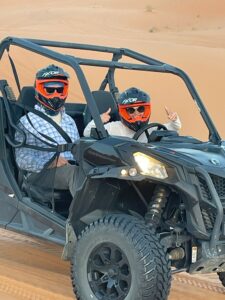 7 Days Morocco Desert Tour from marrakech ,A camel caravan trekking across the golden sand dunes of the Erg Chebbi Sahara desert at sunset..A line of camels, led by Berber guides, walks along the crest of a high dune in the Erg Chebbi desert. The sky is painted with hues of orange and pink as the sun sets behind the rolling Sahara dunes.,A breathtaking view from the Morocco desert tour: a caravan of tourists on camels treks towards a traditional Berber desert camp in the Erg Chebbi dunes. The setting sun casts long shadows on the golden sand, creating a classic Sahara desert scene..Camel trek on the 7-day Morocco desert tour from Marrakech, specifically in the Erg Chebbi dunes of the Sahara Desert near Merzouga.