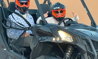 7 Days Morocco Desert Tour from marrakech ,A camel caravan trekking across the golden sand dunes of the Erg Chebbi Sahara desert at sunset..A line of camels, led by Berber guides, walks along the crest of a high dune in the Erg Chebbi desert. The sky is painted with hues of orange and pink as the sun sets behind the rolling Sahara dunes.,A breathtaking view from the Morocco desert tour: a caravan of tourists on camels treks towards a traditional Berber desert camp in the Erg Chebbi dunes. The setting sun casts long shadows on the golden sand, creating a classic Sahara desert scene..Camel trek on the 7-day Morocco desert tour from Marrakech, specifically in the Erg Chebbi dunes of the Sahara Desert near Merzouga.