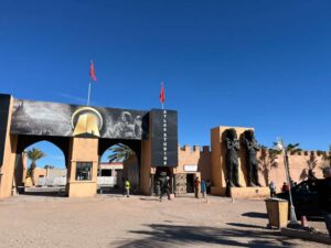 9 Days Marrakech Desert Tour/Travelers riding camels at sunset during a 9-day Marrakech desert tour in the Sahara Erg Chebbi dunes