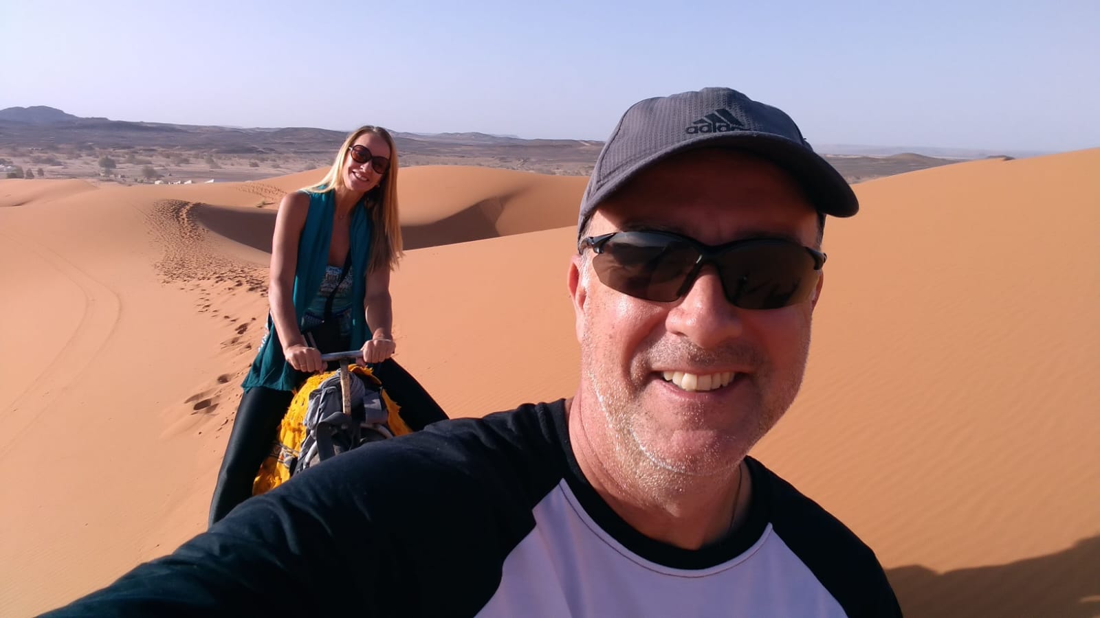 Five Day Marrakech Desert Itinerary.Camel trek at sunset in Erg Chebbi dunes during 5 day Marrakech desert itinerary - Morocco desert tour highlight