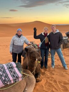 Morocco 6 Day From Marrakech Tour,Camel caravan at sunset in Merzouga during a 6-day Morocco tour from Marrakech; Panoramic view of Ait Ben Haddou kasbah on a 6-day itinerary.