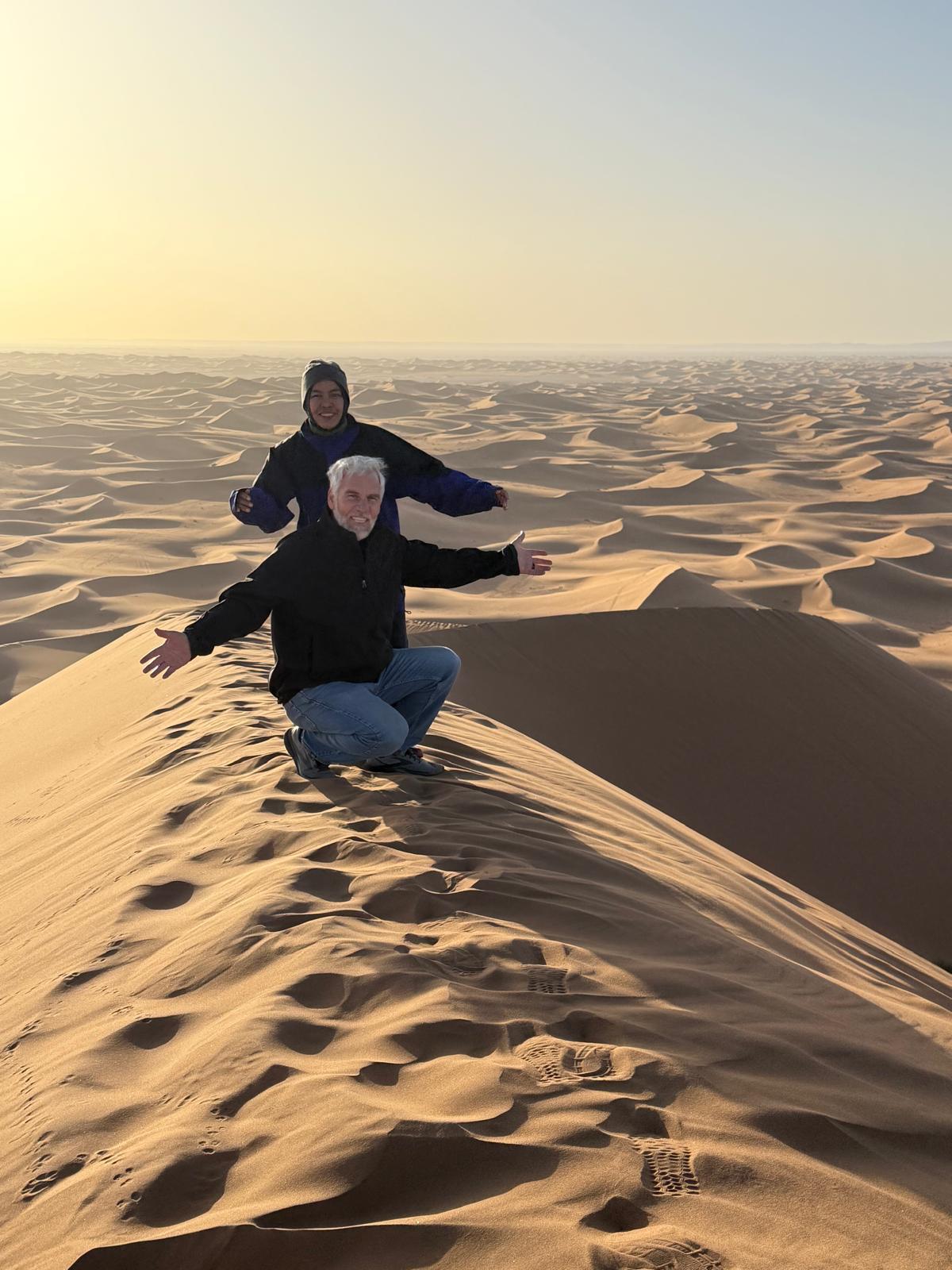 Authentic Morocco Itinerary.Luxury camel trek at sunset in Erg Chebbi Sahara Desert Morocco